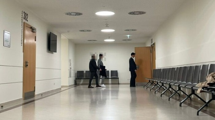 The defendant (here with his father) was accused of raping the then twelve-year-old girl in a ...