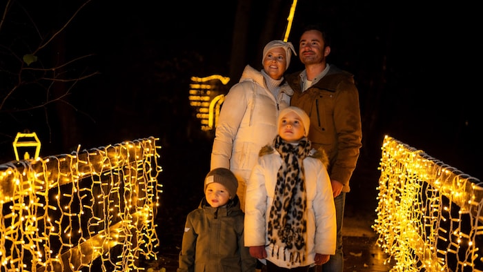 A family at the start of the one-kilometer light trail.