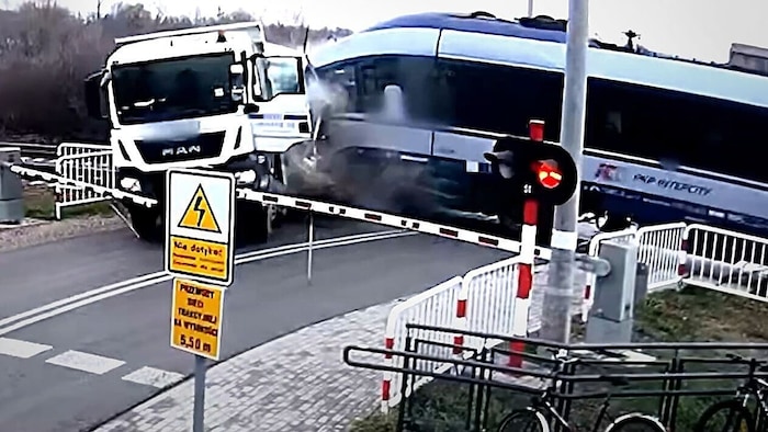 The intercity train hurled the truck off the tracks like a toy.