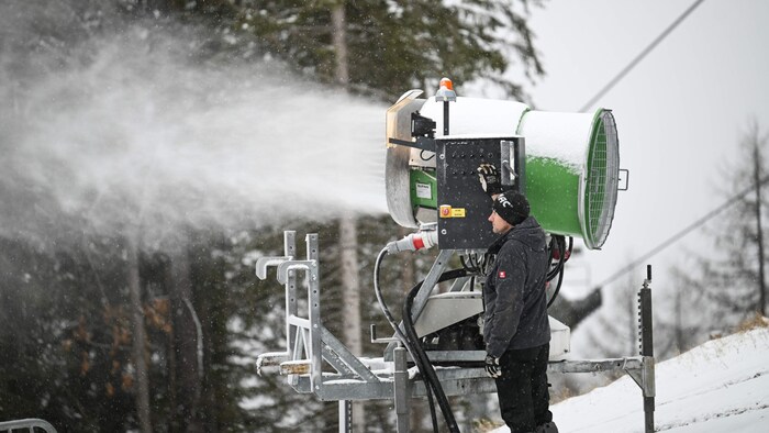 Andreas Großholzner checks the snowmaking equipment.