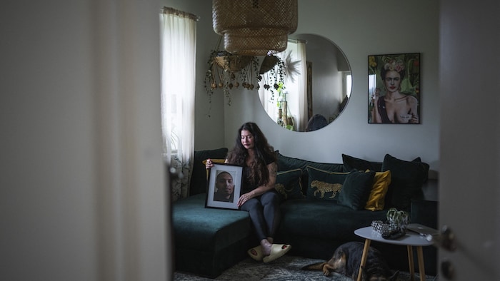 Maritha O. in Stockholm with a picture of her son Marley, who was shot dead in 2015.