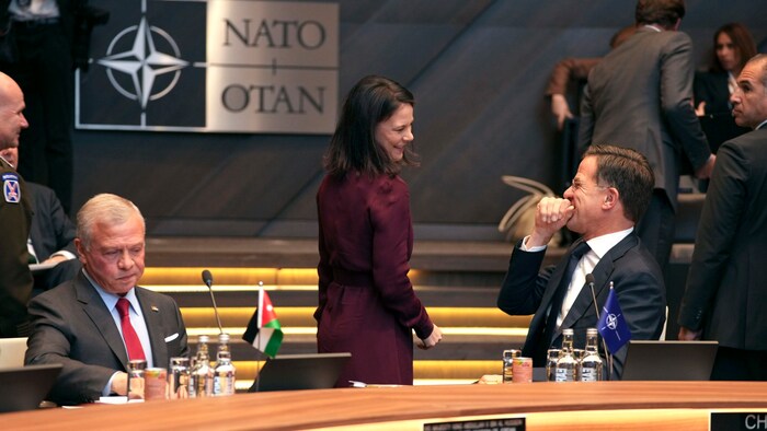 NATO Secretary General Mark Rutte (right) jokes with German Foreign Minister Annalena Baerbock ...