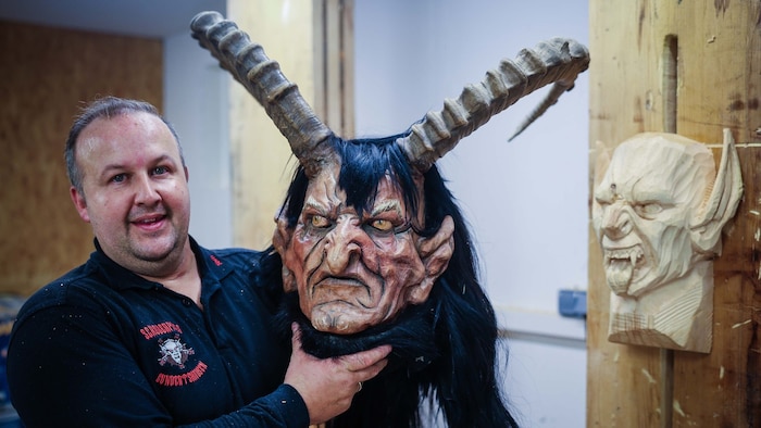 Tom Aigner, co-founder of Schoberpass, makes Krampus masks himself.