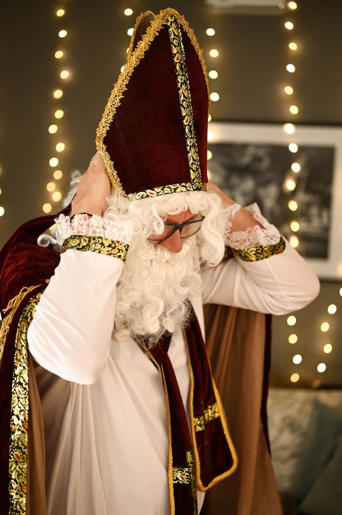 The mitre is a clear distinguishing feature