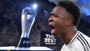 Vinicius Junior schnappt sich die Trophäe. (Bild: AFP/Harold Cunningham, AP/Spada)