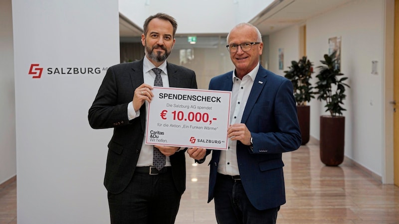 Salzburg-AG-CEO Michael Baminger (li.) mit Caritas-Salzburg-Direktor Johannes Dines. (Bild: Caritas Salzburg)