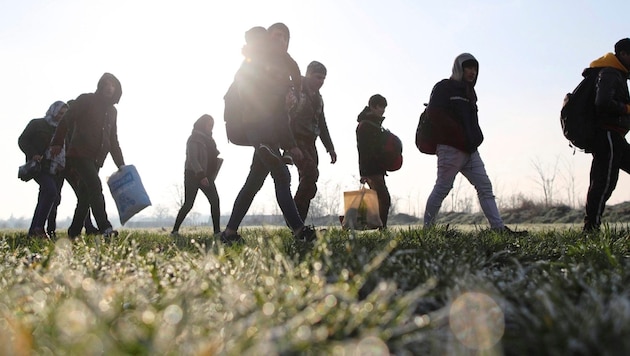 Migrantinnen und Migranten
