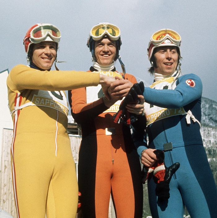 The winners' podium of the 1972 Sapporo Olympic downhill: Heinrich Messner, Bernhard Russi and ...