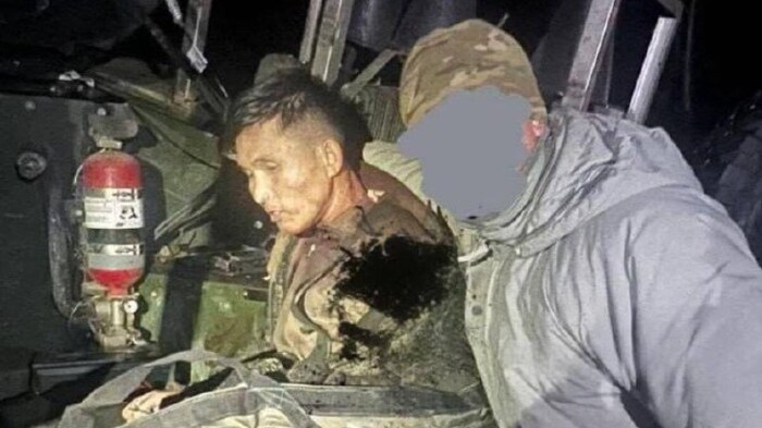 This photo shared by Ukrainian sources is said to show a North Korean prisoner of war. He is ...