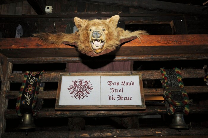One or two hunting trophies serve as decoration in the rustic interior.