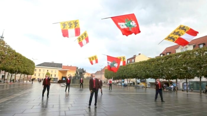 The flags are thrown up and caught again.