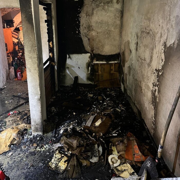 The garbage room burned out completely.