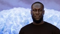 Rapper Stormzy erhielt ein neunmonatiges Fahrverbot, nachdem er mit einem Handy hinter dem Steuer seines Rolls-Royce erwischt wurde. (Bild: APA/AFP/Tolga AKMEN)