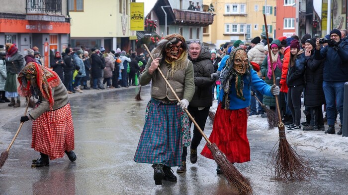 The witches clean the streets before bell tower bearers ring out the bells of spring