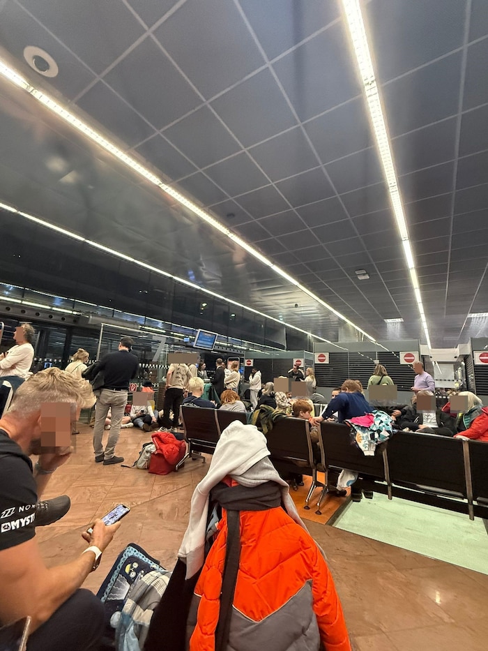Passengers try to keep themselves occupied - with their cell phones, for example.