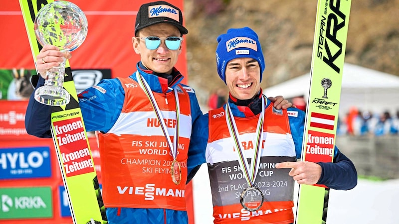 Daniel Huber (li.) mit Kumpel Stefan Kraft. (Bild: AFP/AFP or licensors)