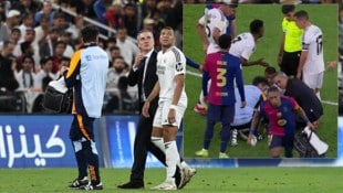 In der 16. Minute verletzte sich Mbappe am Knöchel, Barcelonas Raphinha erschwerte die medizinische Behandlung. (Bild: AFP/APA/FADEL SENNA, X/BarcaUniversal)