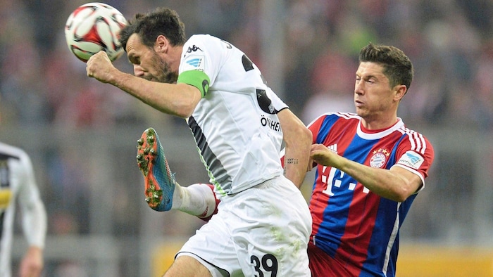 Stranzl also defended against Robert Lewandwoski (right) in the German Bundesliga.