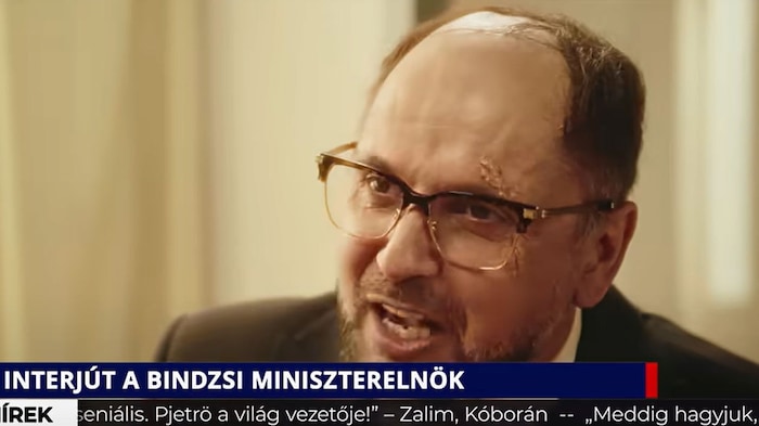 In the video, the prime minister (pictured) of a fictitious country called Bindjistan, under the ...