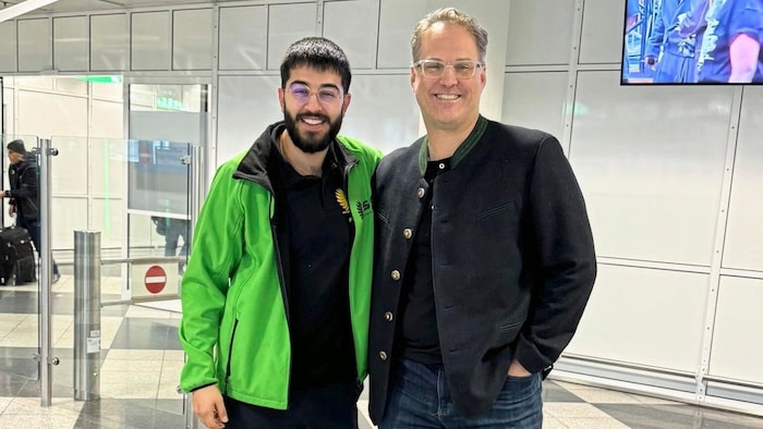Ducks sports boss Ara Einy (left) picked up Ashfield at the airport.