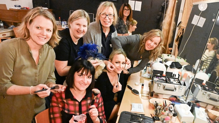 Backstage: the hard-working helpers for make-up and hairstyling. Here Sabrina Nedved is being ...