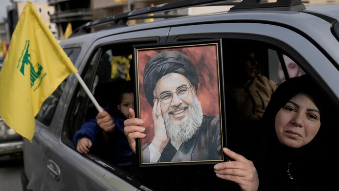 They had Hezbollah flags and portraits of the slain Hezbollah leader with them.