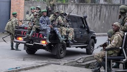 M23-Rebellen in den Straßen von Goma (Bild: APA/AP)