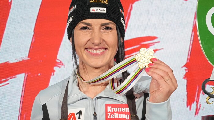 Stephanie Venier beams with her World Championship gold medal.