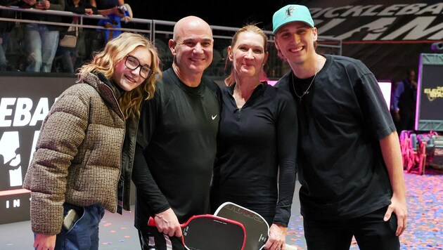 Beaming winners: Tennis icons Andre Agassi and Steffi Graf pose with their children Jaz Elle ...