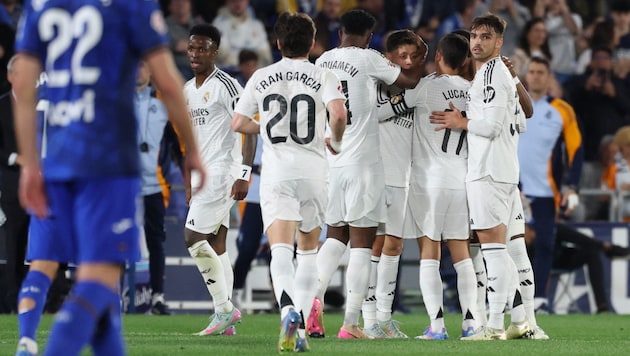 Die Real-Spieler bejubeln den Sieg gegen Getafe (Bild: AFP/AFP or licensors)