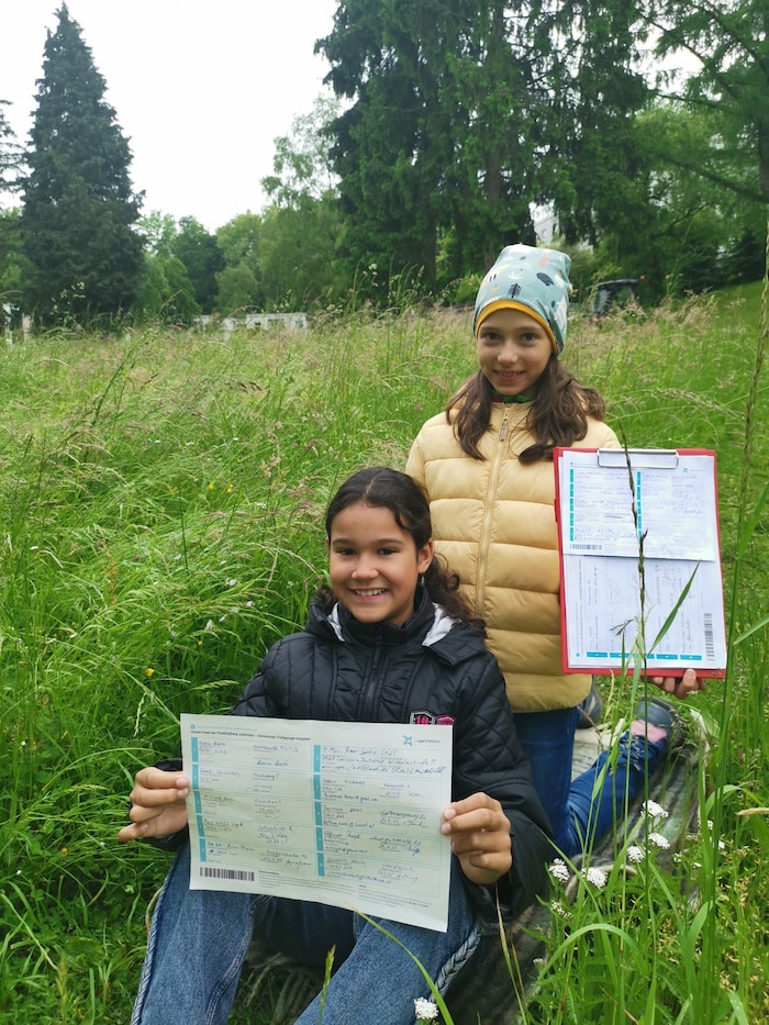 Selbst die Jüngsten der Merkur Siedlung zeigen Einsatz für ihre grüne Oase und sammeln Unterschriften gegen das umstrittene Projekt.