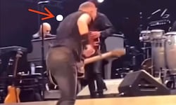 In dem KI-generierten Video wird Bruce Springsteen von einem Golfball am Rücken getroffen.