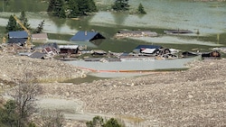 Das verschüttete und überflutete Dorf Blatten in Schweizer Kanton Wallis  (Bild: AFP/FABRICE COFFRINI)