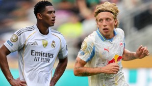Kann Salzburg (mit Mads Bistrup re.) heute Real Madrid (mit Jude Bellingham li.) vor Probleme ...