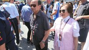 Chalerm Yoovidhya und seine Frau besuchen ein Formel-1-Rennen.