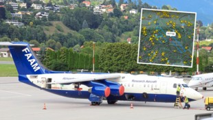 Eines der Forschungsflugzeuge am Innsbrucker Flughafen. Auf einer Webseite (kleines Bild) kann ...