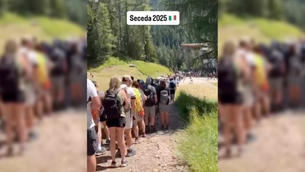 Warten statt Wandern: Die Bilder von Hunderten Bergtouristen in den Dolomiten, die für einen ...