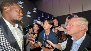 Usain Bolt (links) zieht immer noch große Aufmerksamkeit auf sich.