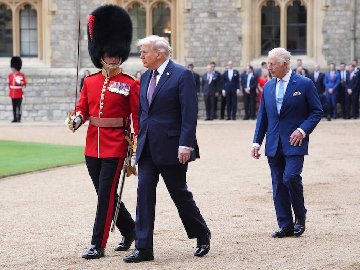 After the carriage ride, Charles and Trump walked the gardens.
