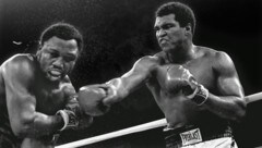Am 1. Oktober 1975 treffen Joe Frazier (li.) und Muhammed Ali in Manila aufeinander – es wird ...