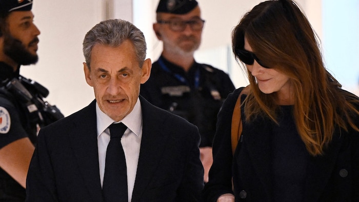 Sarkozy with his wife Carla Bruni before the verdict was announced
