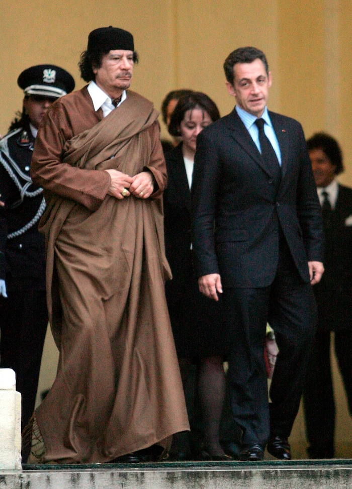 Sarkozy and Gaddafi leave the Elysee Palace in Paris after a meeting (archive photo from 2007).