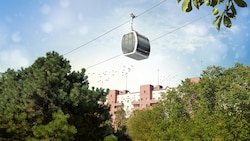 Eine Seilbahn-Gondel vor dem Karl-Marx-Hof: Die Trasse der rund 5,6 Kilometer langen Kabinenbahn ...