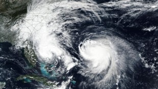 Auf dem von der NASA veröffentlichten Bild ist links der Tropensturm „Imelda“ und rechts ...