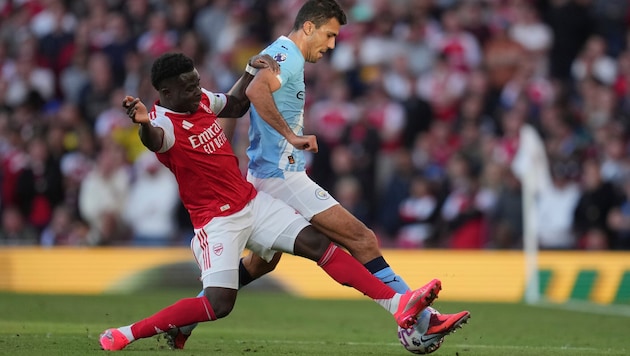 Real Madrid liebäugelt mit einer Verpflichtung von Manchester-City-Star Rodri (re.).