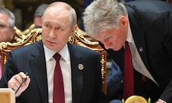 Putin mit seinem Sprecher Peskow