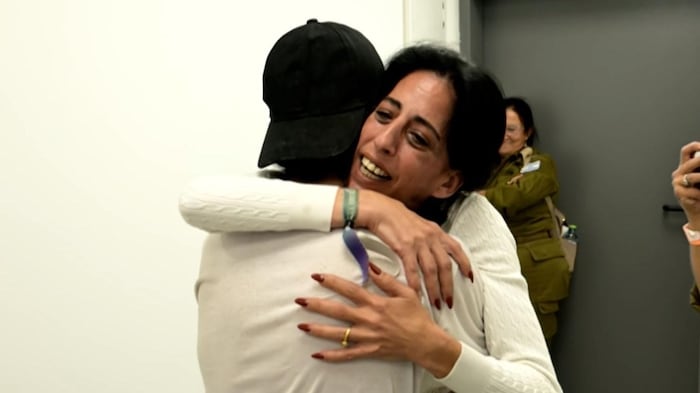Matan Zangauker is embraced by his mother.