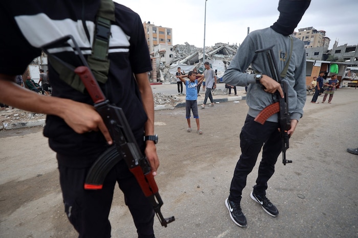 Masked and armed men loyal to Hamas patrol the Gaza Strip.