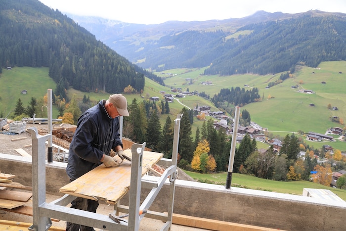 Joachim from Germany, a tenant of the family, also lends a hand.