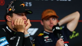 Lando Norris (li.) macht sich über Max Verstappens Team lustig.